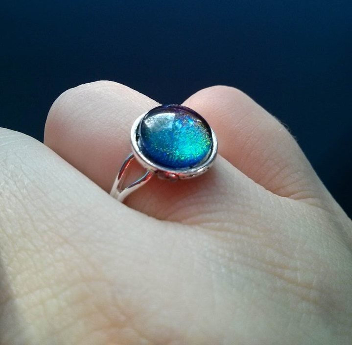 Homemade ring on finger, blue